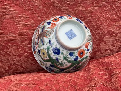 Lot 329 - A pair of Chinese porcelain bowls, Daoguang mark and period, decorated with a dragon and phoenix pattern in the Wucai style, 14.75cm diameter Provenance: brought home by Sir Francis Drum...