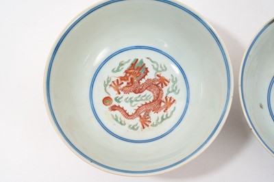 Lot 329 - A pair of Chinese porcelain bowls, Daoguang mark and period, decorated with a dragon and phoenix pattern in the Wucai style, 14.75cm diameter Provenance: brought home by Sir Francis Drum...