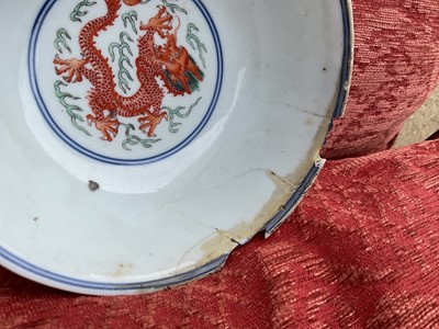 Lot 329 - A pair of Chinese porcelain bowls, Daoguang mark and period, decorated with a dragon and phoenix pattern in the Wucai style, 14.75cm diameter Provenance: brought home by Sir Francis Drum...