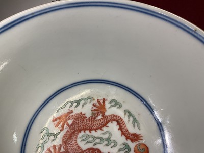 Lot 329 - A pair of Chinese porcelain bowls, Daoguang mark and period, decorated with a dragon and phoenix pattern in the Wucai style, 14.75cm diameter Provenance: brought home by Sir Francis Drum...