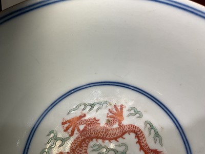 Lot 329 - A pair of Chinese porcelain bowls, Daoguang mark and period, decorated with a dragon and phoenix pattern in the Wucai style, 14.75cm diameter Provenance: brought home by Sir Francis Drum...