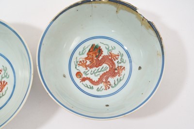 Lot 329 - A pair of Chinese porcelain bowls, Daoguang mark and period, decorated with a dragon and phoenix pattern in the Wucai style, 14.75cm diameter Provenance: brought home by Sir Francis Drum...