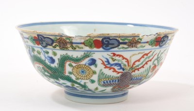 Lot 329 - A pair of Chinese porcelain bowls, Daoguang mark and period, decorated with a dragon and phoenix pattern in the Wucai style, 14.75cm diameter Provenance: brought home by Sir Francis Drum...