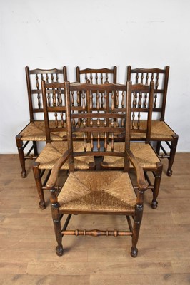 Lot 1609 - Set of six late 19th / early 20th century spindle back chairs, each with rush seat on turned supports, to include one carver