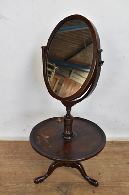 Lot 1608 - George III mahogany shaving stand, with oval hinged mirror plate rising on adjustable thread from dished stand and tripod base