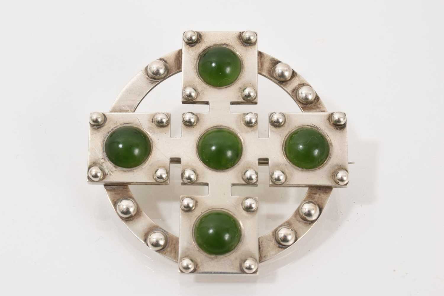 Lot 707 - Unusual Victorian Scottish silver and nephrite brooch, the stylized cross with nephrite cabochons and applied silver beads, 50mm diameter.