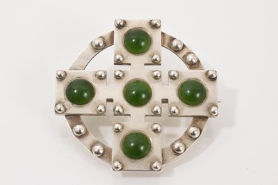 Lot 707 - Unusual Victorian Scottish silver and nephrite brooch, the stylized cross with nephrite cabochons and applied silver beads, 50mm diameter.