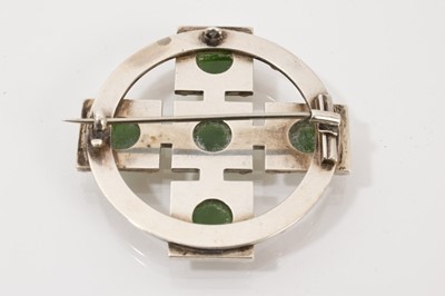 Lot 707 - Unusual Victorian Scottish silver and nephrite brooch, the stylized cross with nephrite cabochons and applied silver beads, 50mm diameter.