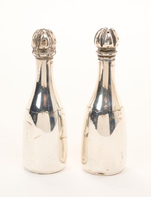 Lot 559 - Unusual pair of novelty silver pepper pots in the form of champagne bottles