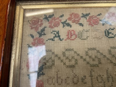 Lot 1145 - Early Victorian needlework sampler