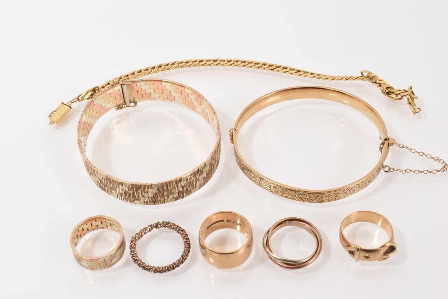 Lot 122 - 9ct three-colour gold bracelet and similar ring, two other 9ct gold rings, 9ct three-colour gold 'Russian' ring, rope twist ring, yellow metal chain bracelet and a gold plated bangle