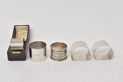 Lot 506 - Group of five silver napkin rings, including a pair (Chester 1946), one in a case (London 1939)