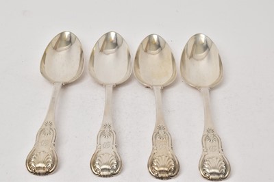 Lot 507 - Four George IV silver single struck Kings pattern table spoons with engraved initials