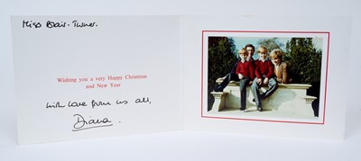 Lot 112 - H.R.H. Diana Princess of Wales, signed 1990 Christmas card with twin gilt Royal ciphers to cover, colour photograph of the Royal couple with their two sons resting on a stone bench inscribed' Mis...