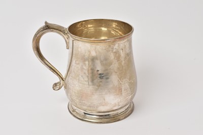 Lot 534 - Contemporary silver tankard of baluster form with scroll handle, raised on a circular foot, (London 1959), maker Garrard & Co, 13.5ozs, 12.5cm in height.