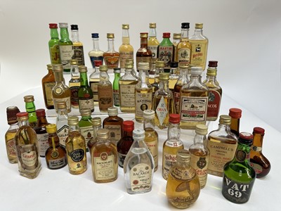 Lot 204 - Alcoholic miniatures, 120 bottles including whisky, vodka, brandy, liquors and others, together with a group of empty bottles (approximately 135 in total)