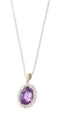 Lot 654 - Amethyst and diamond cluster pendant