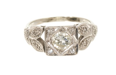 Lot 657 - 1930s diamond single stone ring with a brilliant cut diamond estimated to weigh approximately 0.50ct in square platinum setting with diamond accents and floral shoulders on white gold shank