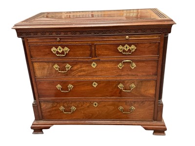 Lot 1724 - Good quality George III mahogany chest of drawers, the top with carved blind fret border and frieze, brushing slide, two short and two long drawers with cast ormolu handles, flanked by fluted pi...