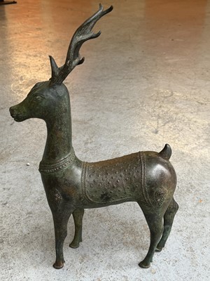 Lot 1186 - Patinated bronze model of a reindeer, 52cm high