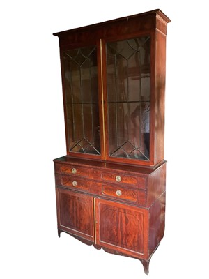 Lot 1693 - Regency mahogany secretaire bookcase of very large proportions, the astragal glazed doors to the upper section, the base with maple lined fitted fall front secretaire...