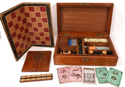 Lot 1179 - Edwardian mahogany games compendium with fitted interior comprising draughts, chess, backgammon, solitaire, dominoes, bezique, cribbage and classic steeplechase horse racing game