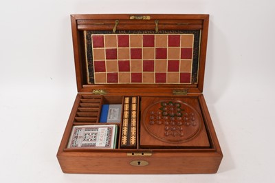 Lot 1179 - Edwardian mahogany games compendium with fitted interior comprising draughts, chess, backgammon, solitaire, dominoes, bezique, cribbage and classic steeplechase horse racing game
