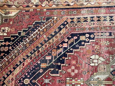 Lot 1735 - Antique Kashgai rug, with radiating medallion in geometric borders, 260 x 165cm