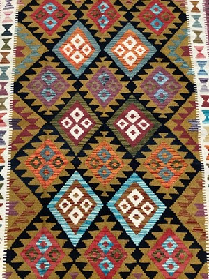 Lot 1749 - Kelim rug with geometric design, approximately 203cm x 126cm