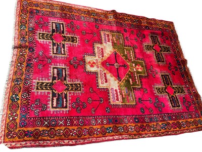 Lot 1754 - Turkish rug with angular medallion on brick red ground in multiple geometric borders, 210 x 150cm, together with two others smaller. (3)