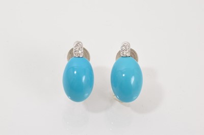 Lot 770 - Pair of turquoise and diamond earrings with an oval turquoise cabochon surmounted by a pavé set diamond mount, in 18ct white gold setting with clip fittings, 20mm.