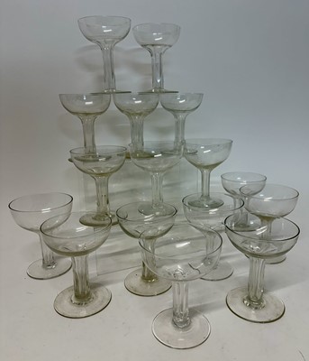 Lot 240 - Sixteen Victorian cut glass champagne coupes with faceted cut glass hollow stems