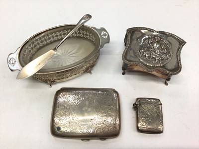 Lot 175 - Art Deco silver butter dish with glass liner and matching silver butter knife, Edwardian silver trinket box, silver cigarette case and silver vest case