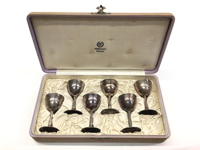 Lot 176 - Set of six Japanese silver saki goblets in fitted case