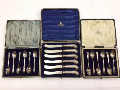 Lot 177 - Two sets of six silver teaspoons and a set of six silver handled butter knives, all in fitted cases (3)