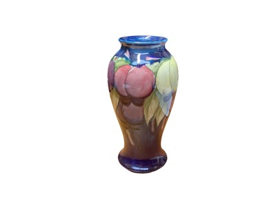 Lot 1139 - Moorcroft pottery vase decorated in the Wisteria pattern, impressed marks and painted signature to base, 18cm high