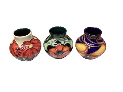 Lot 1151 - Three Moorcroft pottery vases including Poppy, dated 96, trial, and Scarlet, dated 2007, all 8.5cm