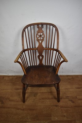 Lot Early 19th century yew, ash and elm wheel back Windsor chair