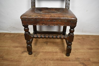 Lot Carolean leather upholstered oak side chair, together with an ash and elm Windsor chair