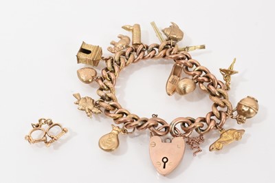 Lot 279 - 9ct gold curb link charm bracelet with padlock clasp and various 9ct gold and yellow metal novelty charms