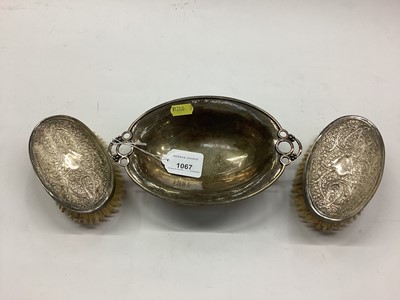 Lot 1067 - Art Deco silver (800 standard) oval dish and a pair of Indian silver/white metal brushes