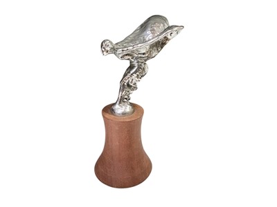 Lot 66 - 1930s Rolls-Royce 20/25 Spirit of Ecstasy mascot on turned wood display plinth, 21.5cm overall.