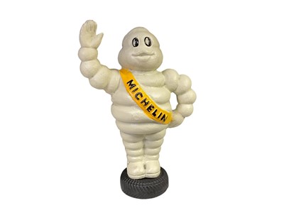 Lot 104 - Reproduction cast metal model of Mr Bibendum (The Michelin man), 23cm in overall height.