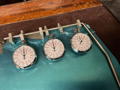 Lot 141 - Three Precista stop watches mounted on a lap timing board as new with protective covering on it, circa. 1970's