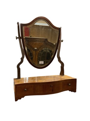 Lot 1387 - 19th century shield shaped mahogany toilet mirror.