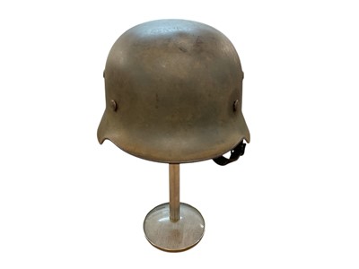 Lot 901 - Second World War Nazi German M35 helmet with single SS decal helmet, camouflage finish and leather lining and chinstrap.