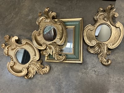 Lot 1317 - Set of three hand carved gilt wood mirrors and another mirror