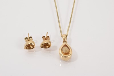 Lot 90 - 9ct gold mounted pear shape mixed cut citrine pendant on chain and matching pair of earrings