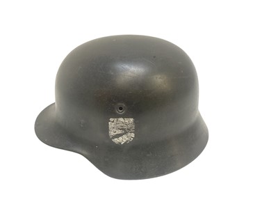 Lot 738 - Second World War Nazi M40 helmet shell with remains of single decal, stamped under brim ET 64.