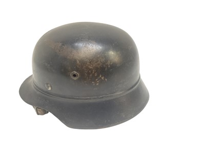 Lot 739 - Second World War Nazi M35 helmet with painted finish, stamped under brim 5591, NS64, with brown leather liner.